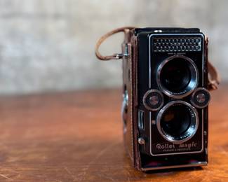 The lot features a Rollei Magic twin-lens reflex (TLR) camera. This vintage medium format camera was produced by the German company Franke & Heidecke between 1960 and 1962. It uses 120 film and produces 6×6 cm images. The camera features a 75mm f/3.5 Schneider Xenar taking lens and a 75mm f/3.5 Heidosmat viewing lens. A key feature of the Rollei Magic is its automatic exposure system, which relies on a built-in selenium light meter. The camera’s design is based on the Rolleicord series and was an early attempt at an automatic camera in the medium format market. Tested and in good working condition.
