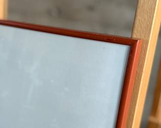 This lot features a professionally framed woodcut print titled, “Binding Sheaths” by listed French artist, Aristide Maillol, circa 1950. This piece measures in frame, 16” H x 20” W. The print depicts two figures harvesting in a field, rendered in a simple, stylized line. The work is an illustration for the book Daphnis and Chloe by Longus, published in 1937. Maillol is best known for his classical and simplified depictions of the female nude in sculpture, but he also worked in painting and graphic arts.
