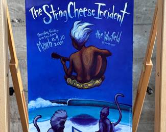This lot features an original concert poster for The String Cheese Incident at The Warfield in San Francisco circa 2001. Promoted by Bill Graham, this poster measures, 19” H x 13” W.

