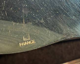 This lot features a stunning set of flatware by Christofle for Neiman Marcus. Each piece is beautifully marked as shown in photos, accompanied with Neiman Marcus covers, and housed in a vintage flatware box for safe storage. Christofle was founded in Paris in 1830 by Charles Christofle, who gained a reputation for his innovative silver plating technology and became a purveyor to the French court. The company grew significantly, supplying its flatware to royalty and even making its mark at international exhibitions, earning awards until at least 1937. Key moments in its history include acquiring the patents for electroplating in 1842, creating the America flatware collection in 1933, and introducing the Aria collection in 1985. 
This set includes two (2) large spoons, one (1) server, one (1) large fork, three (3) knives, twelve (12) big spoons, twelves (12) big forks, twelve (12) standard spoons, and eight (8) standard forks.