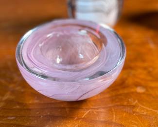 This lot features an assortment of blown glass items including a Murano perfume bottle, an artist signed paperweight, and more.
