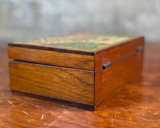 This lot features an antique wooden homeopathic apothecary box used to store various vials of homeopathic remedies. This box measures, 2.75” H x 7.75” W x 5” D.
