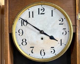 This lot features an antique clock made by the Waterbury Clock Company, with an advertising glass panel for Macdonald Jewelry Company. Appears complete with key, pendulum, instructions, and service records. This clock measures, 35” H x 16” W x 5” D. The Waterbury Clock Company factory is a historic complex of factory buildings in Waterbury, Connecticut. Development began in 1873, with the extensive plant serving as the company’s main manufacturing facility and headquarters until 1944.
