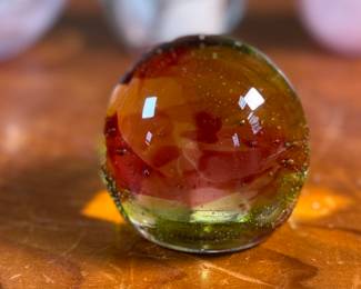 This lot features an assortment of blown glass items including a Murano perfume bottle, an artist signed paperweight, and more.
