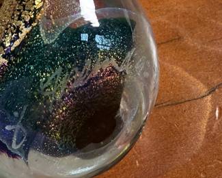 This lot features an assortment of blown glass items including a Murano perfume bottle, an artist signed paperweight, and more.
