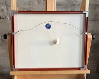 This lot features a professionally framed woodcut print titled, “Binding Sheaths” by listed French artist, Aristide Maillol, circa 1950. This piece measures in frame, 16” H x 20” W. The print depicts two figures harvesting in a field, rendered in a simple, stylized line. The work is an illustration for the book Daphnis and Chloe by Longus, published in 1937. Maillol is best known for his classical and simplified depictions of the female nude in sculpture, but he also worked in painting and graphic arts.
