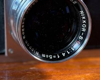 The lot features a vintage Nikon S rangefinder camera with a Nikkor-S 5cm f/1.4 lens. The Nikon S was the first Nikon camera to be imported to the US market. Tested and in good working condition.
