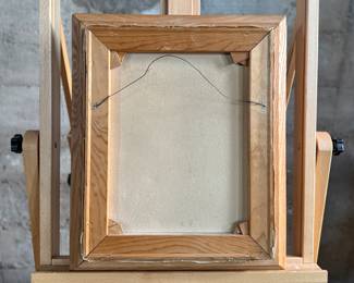 "The Scoutmaster", a vintage print on canvas by listed artist, Norman Rockwell. Professionally framed, this piece was painted in 1956 and depicts a Scoutmaster standing by a campfire at night, with four scouts asleep in tents in the background. This piece measures in frame, 18.5” H x 16” W. Rockwell created the painting as a tribute to American Scoutmasters, capturing a moment of quiet leadership and service.
