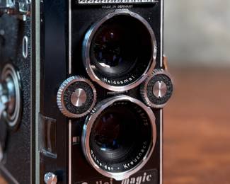 The lot features a Rollei Magic twin-lens reflex (TLR) camera. This vintage medium format camera was produced by the German company Franke & Heidecke between 1960 and 1962. It uses 120 film and produces 6×6 cm images. The camera features a 75mm f/3.5 Schneider Xenar taking lens and a 75mm f/3.5 Heidosmat viewing lens. A key feature of the Rollei Magic is its automatic exposure system, which relies on a built-in selenium light meter. The camera’s design is based on the Rolleicord series and was an early attempt at an automatic camera in the medium format market. Tested and in good working condition.
