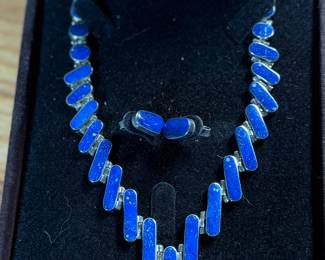 This lot features a stunning silver Lapis graduated necklace and earring set, circa 1960s. Marked .970 silver as shown in photos with a total approx. weight of 42.14 grams. The necklace measures 18” and comes in a nice presentation box.
