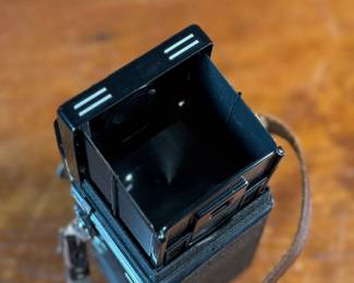 The lot features a Rollei Magic twin-lens reflex (TLR) camera. This vintage medium format camera was produced by the German company Franke & Heidecke between 1960 and 1962. It uses 120 film and produces 6×6 cm images. The camera features a 75mm f/3.5 Schneider Xenar taking lens and a 75mm f/3.5 Heidosmat viewing lens. A key feature of the Rollei Magic is its automatic exposure system, which relies on a built-in selenium light meter. The camera’s design is based on the Rolleicord series and was an early attempt at an automatic camera in the medium format market. Tested and in good working condition.
