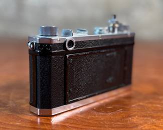 The lot features a vintage Nikon S rangefinder camera with a Nikkor-S 5cm f/1.4 lens. The Nikon S was the first Nikon camera to be imported to the US market. Tested and in good working condition.
