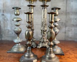 This lot features a collection of six (6) antique brass candlesticks. Three matching pairs with the tallest measuring, 17” H.
