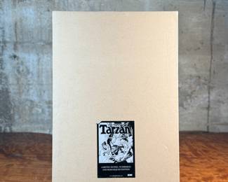 This lot features a publisher’s proof of Joe Kubert’s Tarzan of the Apes Artist’s Edition from IDW Publishing. These books were put out as a limited edition, signed, and mnumbered remarqued edition of the graphic novel. This one in particular is an unsigned publisher’s proof in the original box, in excellent condition. A rare find!

