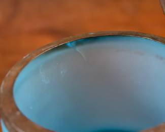 This lot features a vintage French blue opaline glass lidded keepsake box with brass trim that measures, 5” H x 4.75” W x 4.75” D. One small interior crack as shown in photos.
