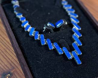 This lot features a stunning silver Lapis graduated necklace and earring set, circa 1960s. Marked .970 silver as shown in photos with a total approx. weight of 42.14 grams. The necklace measures 18” and comes in a nice presentation box.
