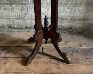 This lot features an antique Eastlake Victorian carved walnut parlor table with a marble top that measures, 28.5” H x 24” W x 16” D.
