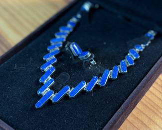 This lot features a stunning silver Lapis graduated necklace and earring set, circa 1960s. Marked .970 silver as shown in photos with a total approx. weight of 42.14 grams. The necklace measures 18” and comes in a nice presentation box.
