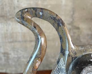 This lot features a stunning polished fossil sculpture featuring embedded ammonite and orthoceras fossils. This sculpture measures, 17.5” H x 12” W x 4” D.
