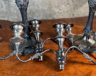 This lot features a pair of antique French Louis XVI style candelabras. Each one measures, 25” H x 16” W x 7” D.
