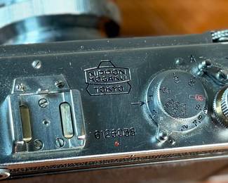 The lot features a vintage Nikon S rangefinder camera with a Nikkor-S 5cm f/1.4 lens. The Nikon S was the first Nikon camera to be imported to the US market. Tested and in good working condition.
