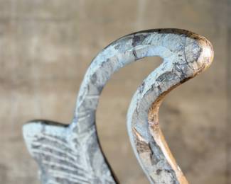 This lot features a stunning polished fossil sculpture featuring embedded ammonite and orthoceras fossils. This sculpture measures, 17.5” H x 12” W x 4” D.
