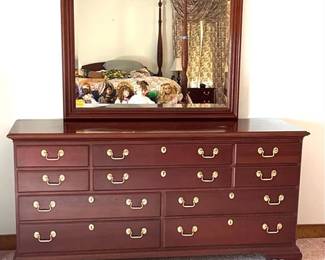 Solid cherry dresser with a beveled glass mirror by Councill Craftsmen