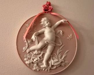 Set of four pink bisque wall plaques