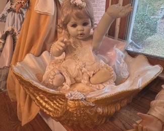 Precious Heirloom doll in a clam shell