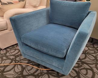 Sebastian Swivel Chair by Jonathan Adler.
