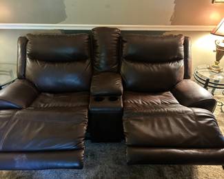 Brown dual electric Love Seat with Console. $600.00
84 w 34 d 40 h