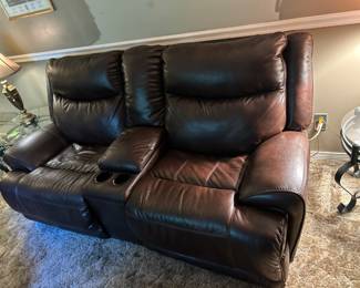 Brown dual electric Love Seat with Console. $600.00
84 w 34 d 40 h