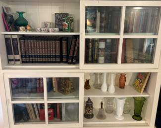 2) White Bookcase curios with sliding glass doors. $ 250.00 each
81.25”w 14”- 15.5” d base 56”t