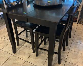 High top table: 6 chairs, hidden drop leaf and lazy Susan $350.00