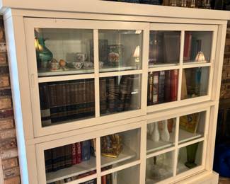 2) White Bookcase curios with sliding glass doors. $ 250.00 each
81.25”w 14”- 15.5” d base 56”t