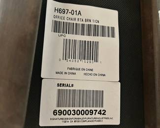 W57 - $40. Ashley Furniture Office Chair. 22" wide x 19.5" deep x 40" tall. Wood with faux leather seat. Very good condition.