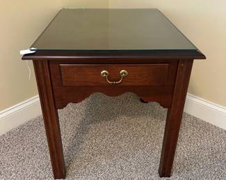 W42 - $50. Single Solid Wood Side Table with glass top. Measures 22" wide x 27" deep x 23.5" tall. Drawer slides easily. Excellent Condition. 