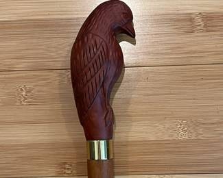 W24 - $50. Carved Eagle Cane with brass band. 