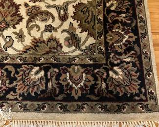 W99 - $100. Entry Rug feels like wool.  Measures 49" x 74". 