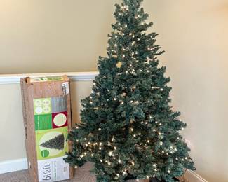 W90 - $50. 6.5' Christmas Tree. Does have a strand of lights out. 