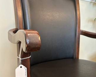 W57 - $40. Ashley Furniture Office Chair. 22" wide x 19.5" deep x 40" tall. Wood with faux leather seat. Very good condition.