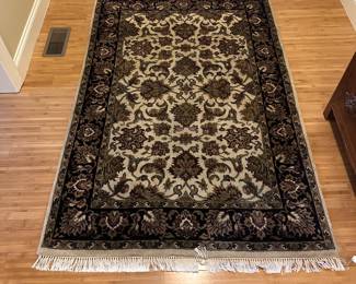 W99 - $100. Entry Rug feels like wool.  Measures 49" x 74". 