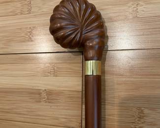 W31 - $40. Carved Shell Cane with brass band and solid wood cane. 