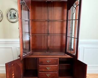 W72 - $150. American Drew Lighted China Cabinet - moves in 2 pieces. Measures 52" wide x 16" deep x 78" tall. Base is 27". Top is 51". Solid wood - very good condition with a few minor marks. 2 glass shelves - not adjustable. 
