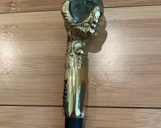 W28 - $30. "Bridges" Eagle Claw Cane with black aluminum shaft. 