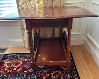 W9 - $125. Solid Wood Tea Cart with single drawer. Measures 33.5" x 19" (35.5" with leaves out) x 28" tall. 2 large wheels & 2 small wheels. Does roll easily. 