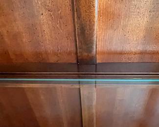 W72 - $150. American Drew Lighted China Cabinet - moves in 2 pieces. Measures 52" wide x 16" deep x 78" tall. Base is 27". Top is 51". Solid wood - very good condition with a few minor marks. 2 glass shelves - not adjustable. 