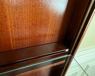 W72 - $150. American Drew Lighted China Cabinet - moves in 2 pieces. Measures 52" wide x 16" deep x 78" tall. Base is 27". Top is 51". Solid wood - very good condition with a few minor marks. 2 glass shelves - not adjustable. 