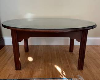 W15 - $75. Solid Wood Coffee Table with drop down leaves. Has glass cut to protect the top. Measures 29" x 29" x 17.5" tall. (If you fold the leaves and take off the glass it up measures 20" x 28" x 17.5" tall.)