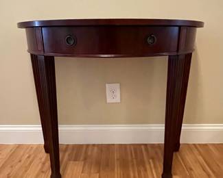 W10 - $65. Bombay Demilune Table. Has single drawer. Measures 35.5" wide x 17.75" deep x 30" tall. Some gentle wear marks on the legs. 